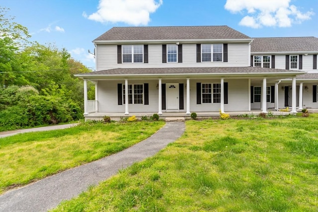 20 Miller St, Rehoboth, MA 02769 - view of front facade featuring a front yard, covered porch, and roof with shingles