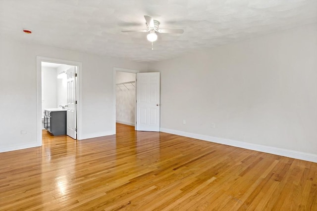 20 Miller St, Rehoboth, MA 02769 - unfurnished bedroom featuring a spacious closet, baseboards, light wood-style floors, and a closet
