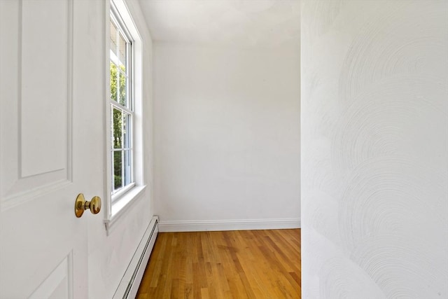 20 Miller St, Rehoboth, MA 02769 - empty room featuring baseboard heating, light wood-style floors, and baseboards