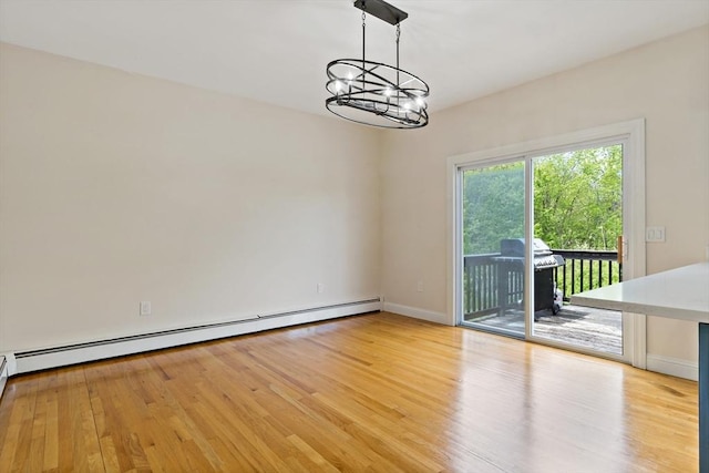 20 Miller St, Rehoboth, MA 02769 - spare room featuring baseboard heating, a chandelier, light wood finished floors, and baseboards