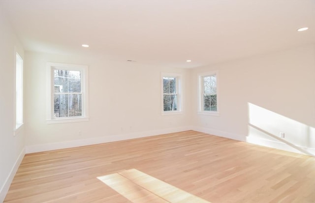 empty room with light hardwood / wood-style floors