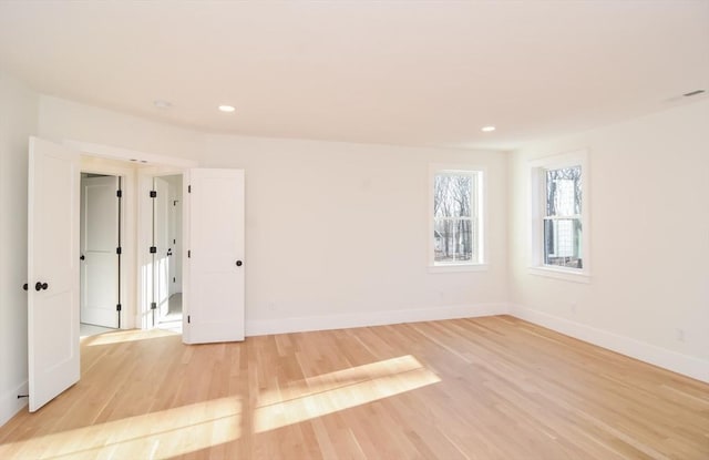 unfurnished room featuring light wood-type flooring