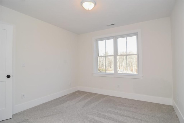 empty room with light colored carpet