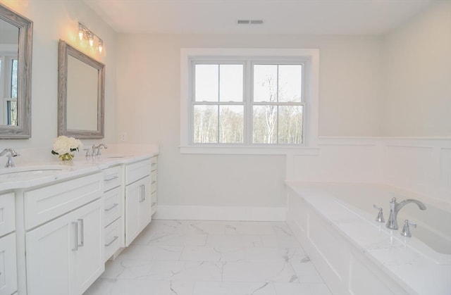 bathroom with a bathing tub and vanity