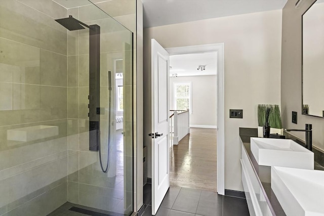 122 Green St, Northborough, MA 01532 - bathroom with tiled shower, double vanity, tile patterned flooring, and baseboards