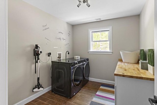 122 Green St, Northborough, MA 01532 - washroom featuring washer and dryer, baseboards, and dark wood-type flooring