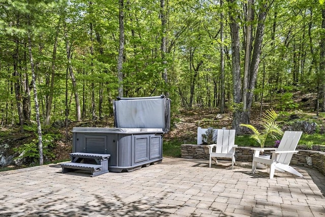 122 Green St, Northborough, MA 01532 - view of patio with a forest view and a hot tub