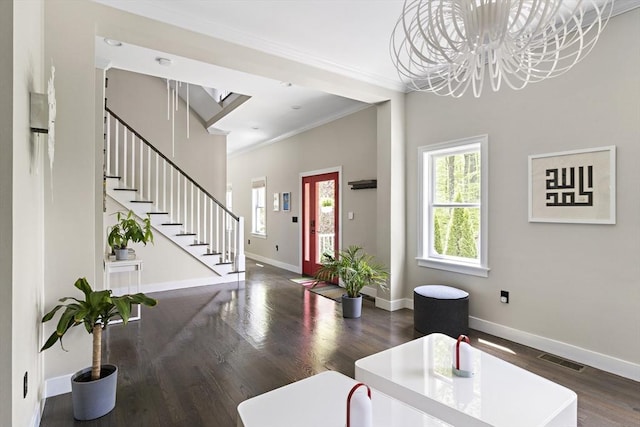 122 Green St, Northborough, MA 01532 - entrance foyer with ornamental molding, stairway, wood finished floors, baseboards, and a chandelier