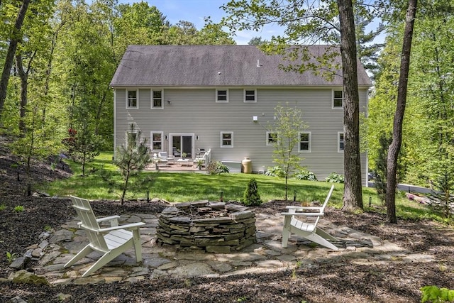 122 Green St, Northborough, MA 01532 - rear view of property featuring a fire pit, a patio area, and a lawn
