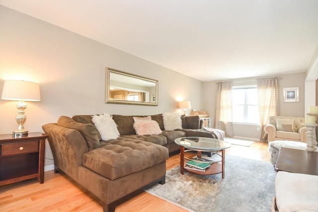 living room with light wood-style floors and baseboards