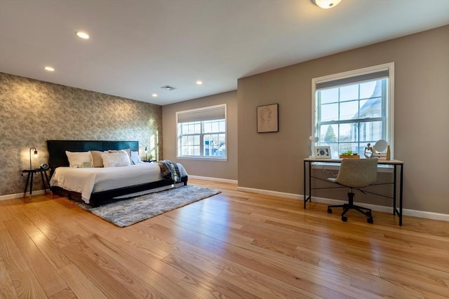 bedroom featuring wallpapered walls, recessed lighting, light wood-style floors, and baseboards