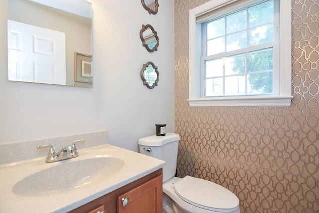 bathroom with vanity and toilet