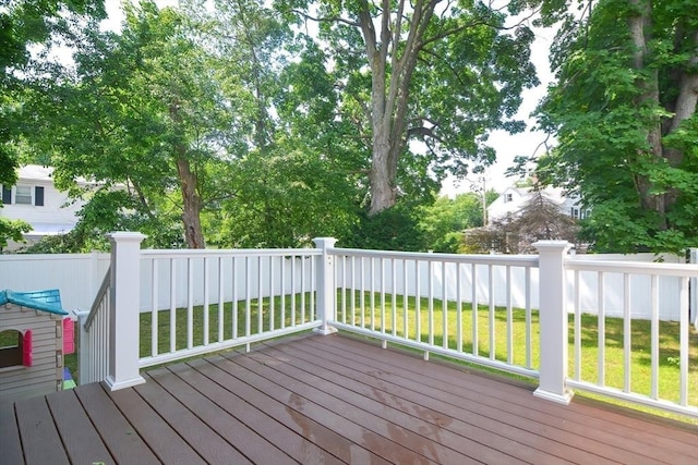 wooden terrace with a lawn