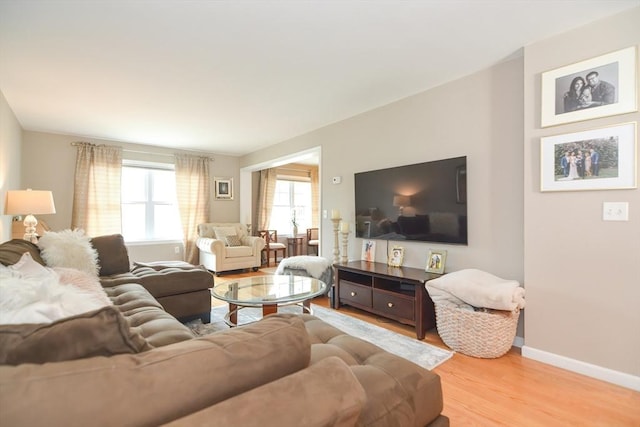 living room with wood finished floors and baseboards