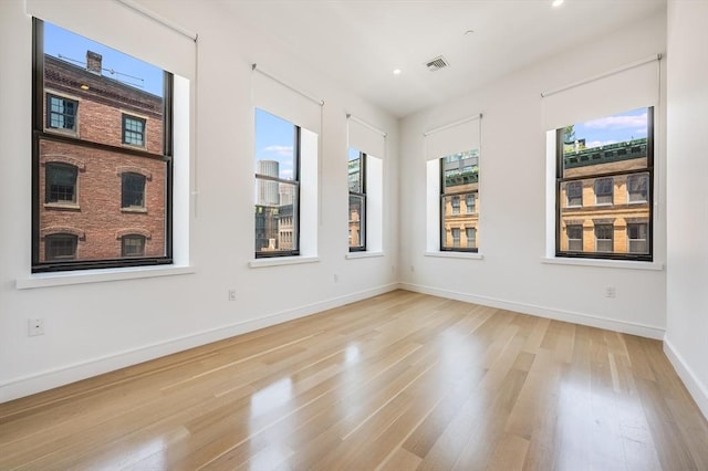 unfurnished room featuring light hardwood / wood-style flooring