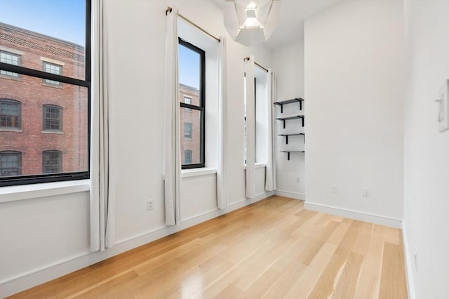 unfurnished bedroom featuring light wood-type flooring