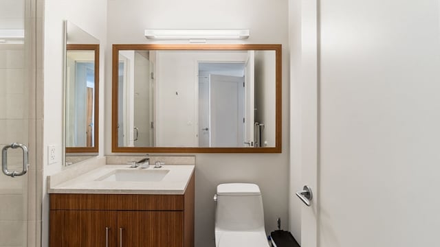 bathroom with oversized vanity and toilet