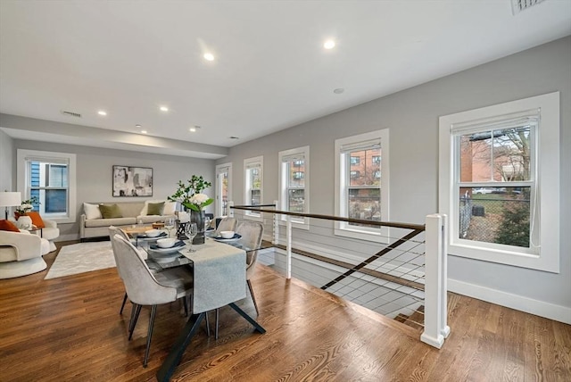 dining area featuring plenty of natural light and hardwood / wood-style floors