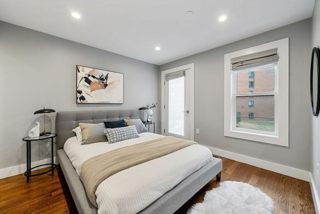 bedroom with dark wood-type flooring