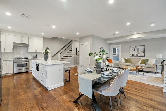 dining space featuring dark wood-type flooring