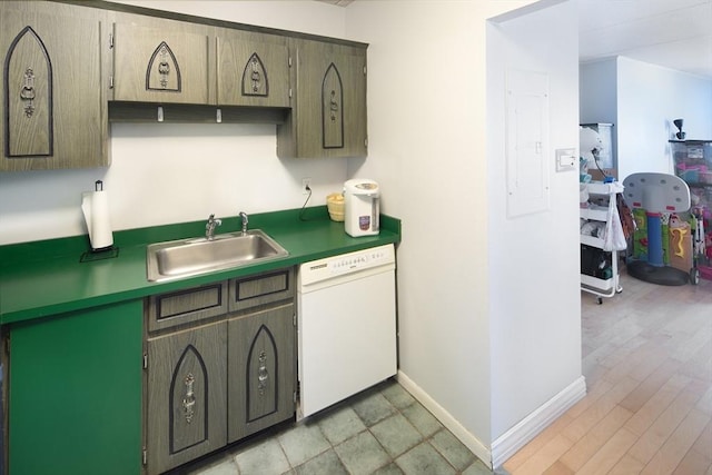 kitchen with electric panel, baseboards, dark countertops, white dishwasher, and a sink