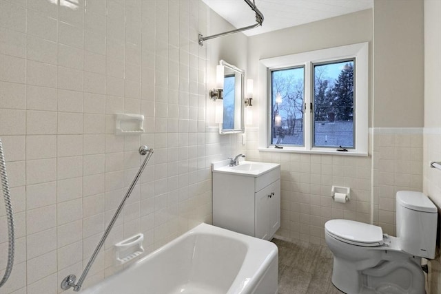 full bathroom featuring tile patterned floors, vanity, toilet, and tile walls