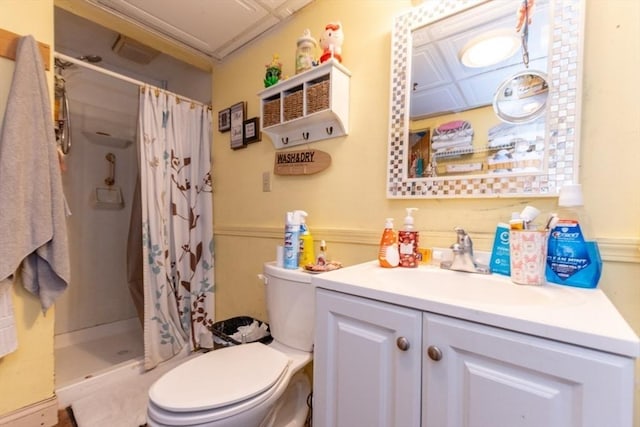 full bath featuring a stall shower, vanity, and toilet