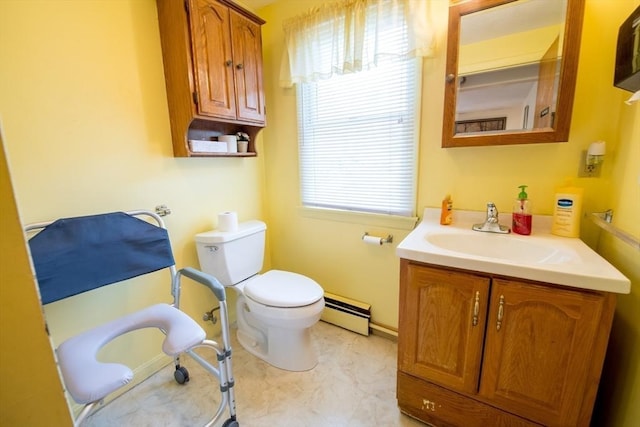 bathroom featuring baseboard heating, vanity, and toilet