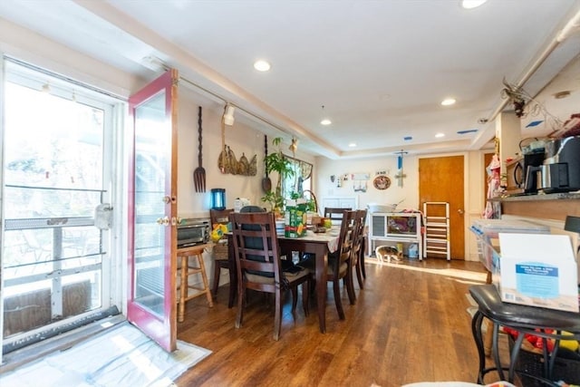 dining space featuring a wealth of natural light, recessed lighting, and wood finished floors