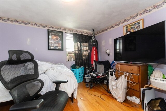 bedroom featuring wood finished floors