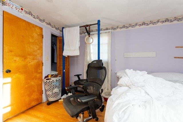 bedroom featuring wood finished floors