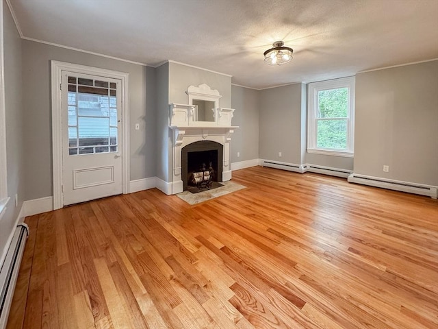 624 Western Ave, Gloucester, MA 01930 - unfurnished living room featuring baseboard heating, light wood-type flooring, a fireplace with flush hearth, and ornamental molding