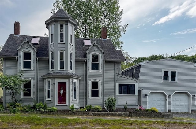 624 Western Ave, Gloucester, MA 01930 - victorian-style house featuring a chimney, a garage, and a shingled roof