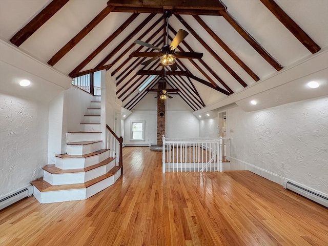 624 Western Ave, Gloucester, MA 01930 - unfurnished living room with a textured wall, high vaulted ceiling, beam ceiling, wood finished floors, and a ceiling fan