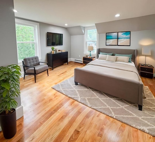 624 Western Ave, Gloucester, MA 01930 - bedroom featuring baseboard heating, wood finished floors, recessed lighting, and a baseboard radiator