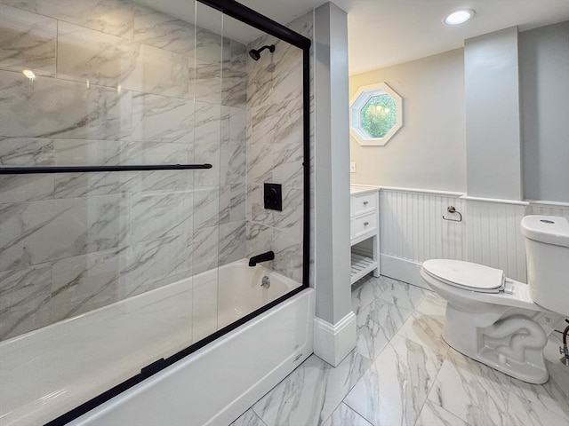 624 Western Ave, Gloucester, MA 01930 - bathroom with marble look tile flooring, a wainscoted wall, enclosed tub / shower combo, and recessed lighting