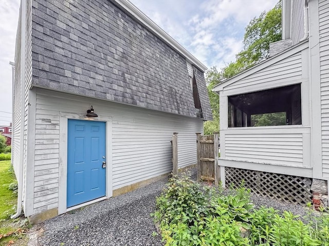 624 Western Ave, Gloucester, MA 01930 - view of home's exterior featuring roof with shingles and a sunroom
