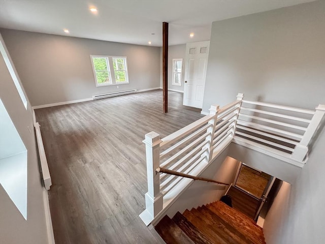 624 Western Ave, Gloucester, MA 01930 - stairs with a baseboard heating unit, wood finished floors, and recessed lighting