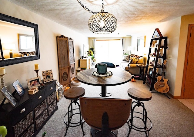 dining space with a textured ceiling