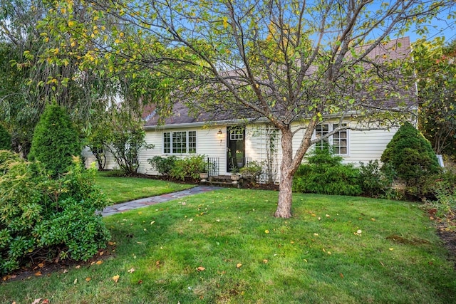 view of front of home with a front yard