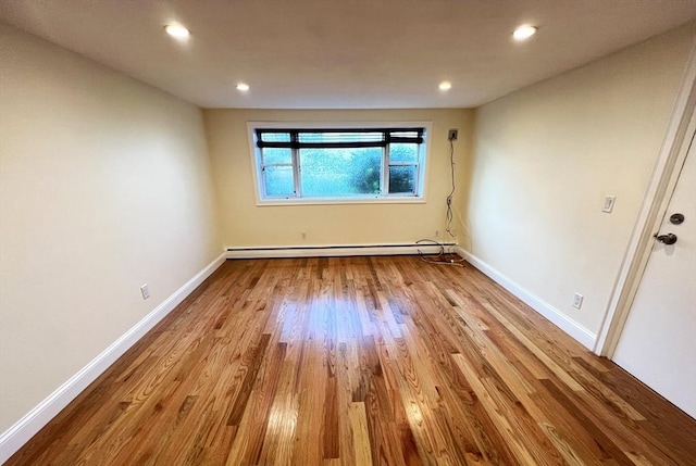 475-479 Sea St Unit 2, Quincy, MA 02169 - unfurnished room featuring a baseboard radiator, wood finished floors, and recessed lighting