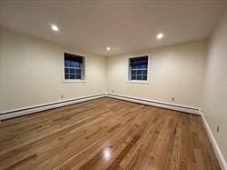 475-479 Sea St Unit 2, Quincy, MA 02169 - spare room with wood finished floors, recessed lighting, and baseboard heating