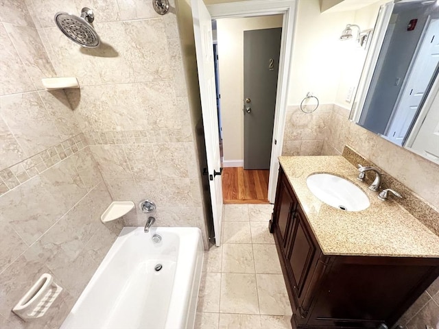 475-479 Sea St Unit 2, Quincy, MA 02169 - bathroom with vanity, tile walls, tile patterned flooring, and shower / bathtub combination