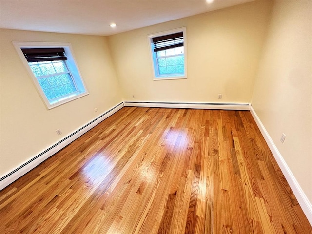 475-479 Sea St Unit 2, Quincy, MA 02169 - empty room with wood finished floors, a baseboard heating unit, and recessed lighting