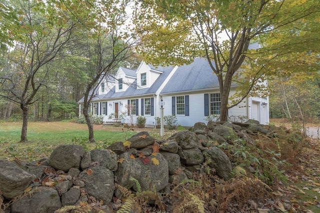 cape cod house with a garage