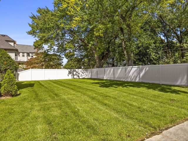 view of yard with a fenced backyard