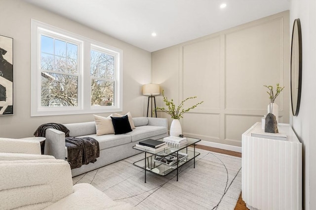 living room with light hardwood / wood-style flooring