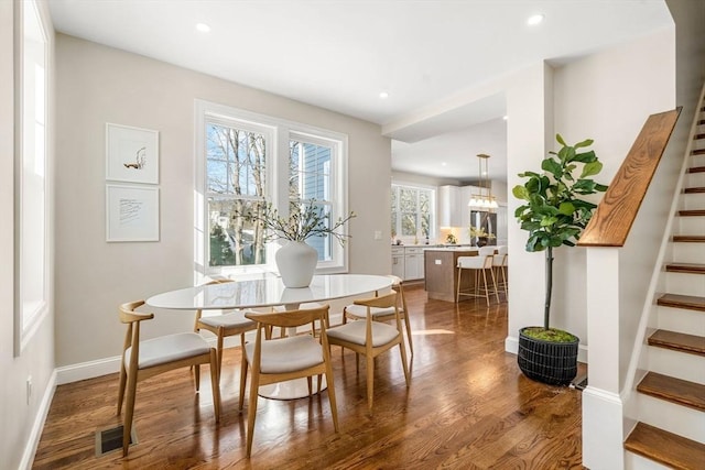 dining room with wood-type flooring