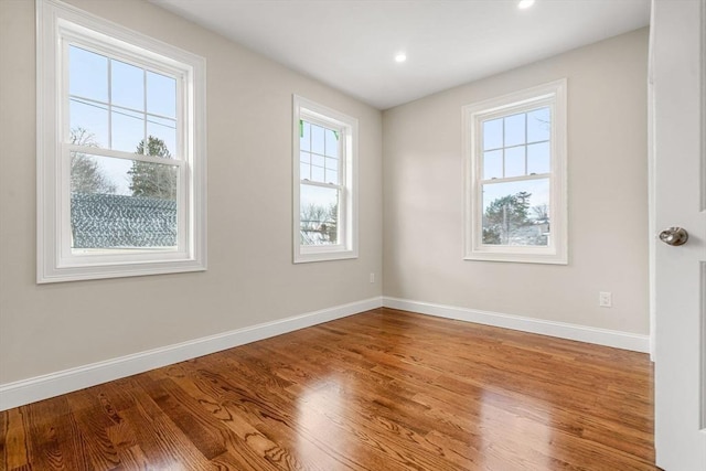 spare room with light hardwood / wood-style floors