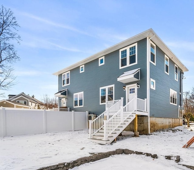 view of snow covered house